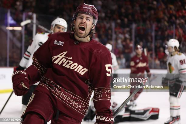 Michael Carcone of the Arizona Coyotes celebrates after scoring a goal against the Chicago Blackhawks during the second period of the NHL game at...
