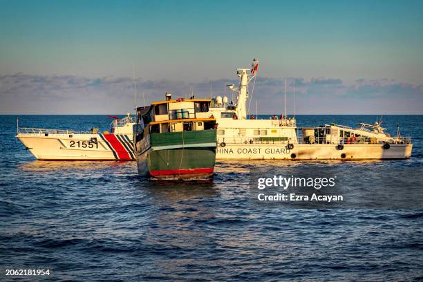 Unaizah May 4, a Philippine Navy chartered vessel, conducting a routine resupply mission to troops stationed at Second Thomas Shoal, is blocked by a...