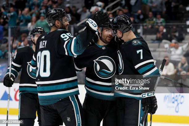 Ryan Carpenter of the San Jose Sharks is congratulated by Justin Bailey and Nico Sturm after he scored against the Dallas Stars in the second period...