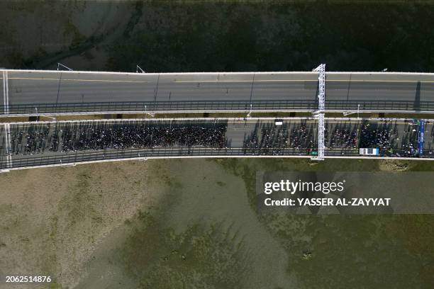 In this aerial view, people take part in the first edition of the Kuwait Sports Day marathon, along the Sheikh Jaber al-Ahmad al-Sabah Causeway in...