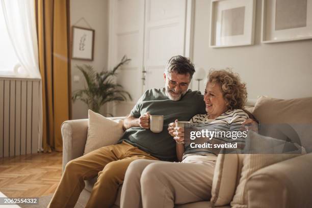 relaxed day at home - middle age couple drinking coffee stock pictures, royalty-free photos & images