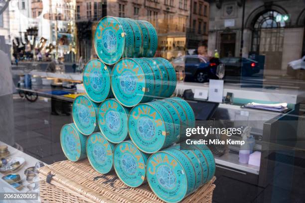 Cans of Prunier Manufacture French caviar in the Beluga caviar shop window display at Caviar House in Piccadilly on 5th February 2024 in London,...