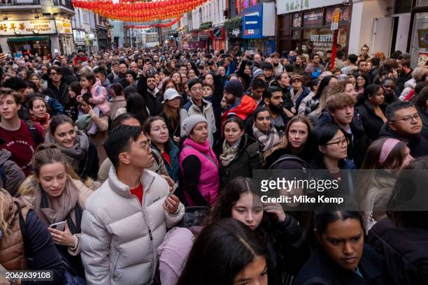 Crowds gather to watch a Lion Dance to celebrate the Chinese New Year of the Dragon enters restaurants in Chinatown to bless them for the year ahead...