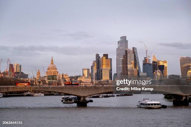 City of London skyline view looking over the River Thames and Waterloo Bridge at sunset on 10th February 2024 in London, United Kingdom. The City of...