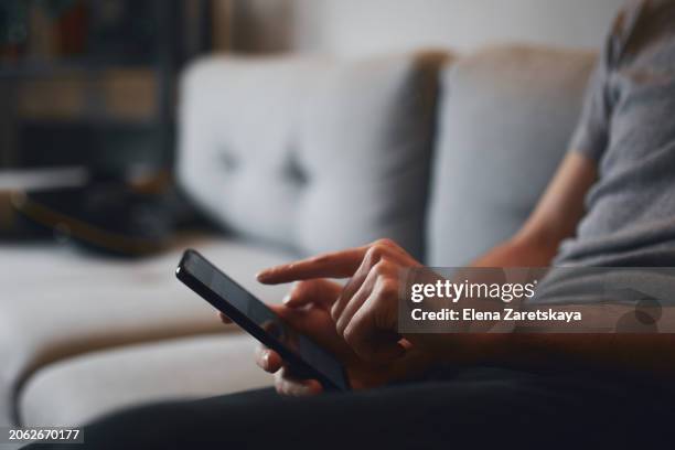 close-up of men's hands with a smartphone - iphone text stock pictures, royalty-free photos & images