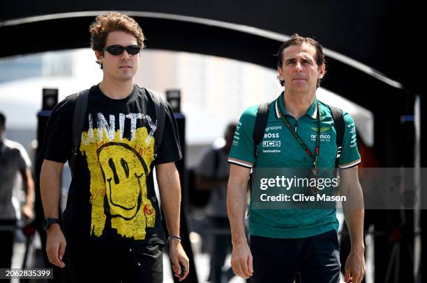 Felipe Drugovich of Brazil and Aston Martin F1 Team and Pedro de la Rosa of Spain and Aston Martin F1 Team walk in the Paddock during previews ahead...