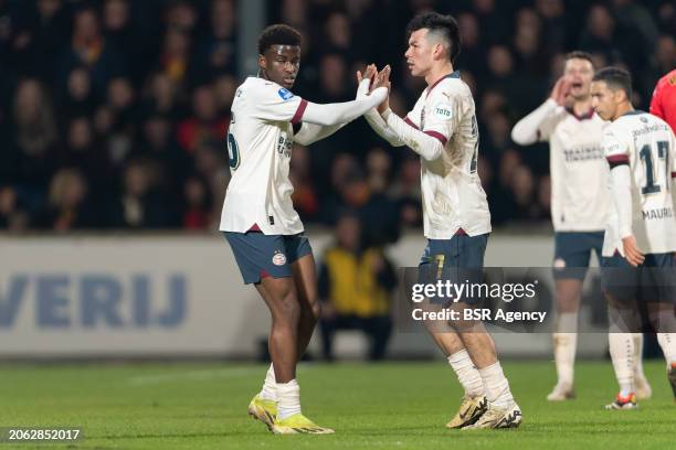 Isaac Babadi of PSV interacts with Hirving Lozano of PSV during the Dutch Eredivisie match between Go Ahead Eagles of the PSV at De Adelaarshorst on...