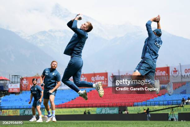 Zak Crawley of England catches in the slips alongside Ben Duckett, Jonathan Bairstow and Joe Root during a nets session at Himachal Pradesh Cricket...