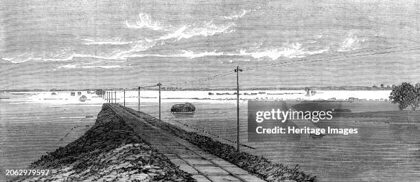 The Flood in the Fens: the submerged railway between Lynn and Wisbeach, 1862. 'From the summit of the Middle-Level railway-bridge almost the entire...