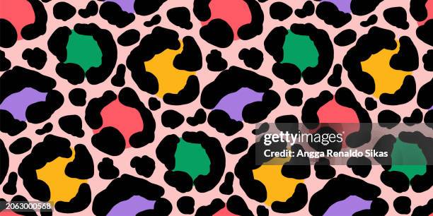colorful leopard spotted skin seamless pattern - leopard print stock illustrations