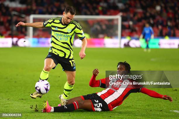 Andre Brooks of Sheffield United challenges Cedris Soares of Arsenal during the Premier League match between Sheffield United and Arsenal FC at...