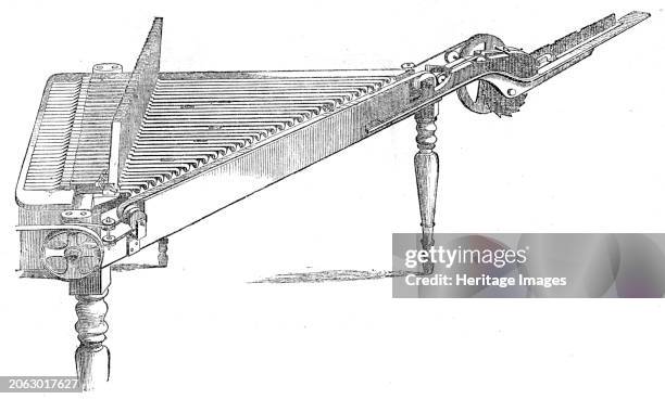 The International Exhibition: Mitchel's type-composing machine, 1862. 'The compositor is in shape a right-angled triangle, placed horizontally, with...