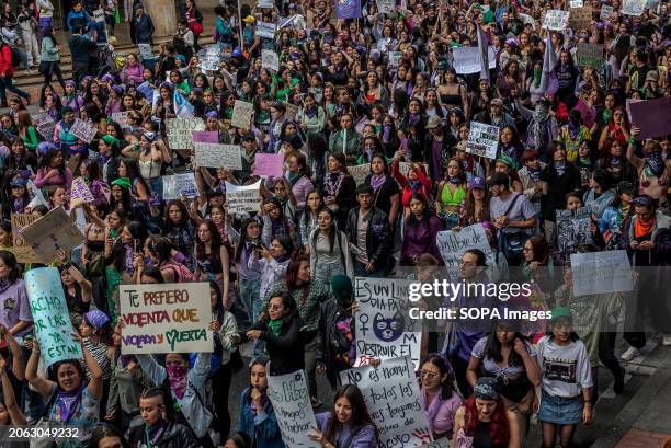 Hundreds of women walk down Bogotá's Seventh Avenue to celebrate International Women's Day. Bogotá wore purple on 8 March, International Women's Day,...