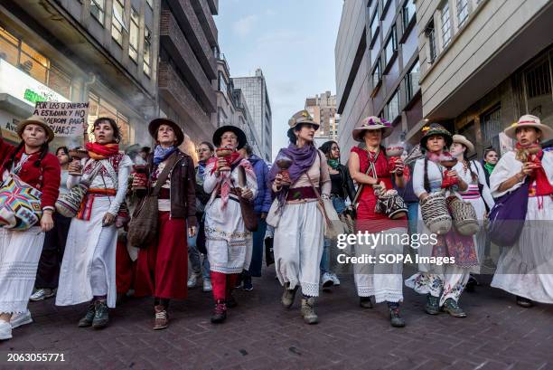 The group of women lead the march in commemoration of International Women's Day 2024. Bogotá wore purple on 8 March, International Women's Day, in a...