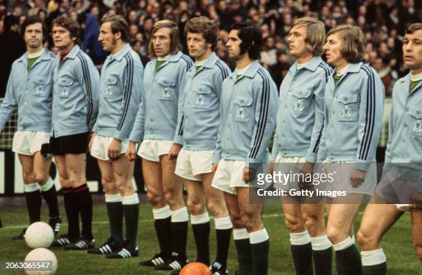 The West Germany team line up in blue Adidas Tracksuit jacket tops including Franz Beckenbauer Josef Sepp Maier , Gunter Netzer and Gerd Muller...