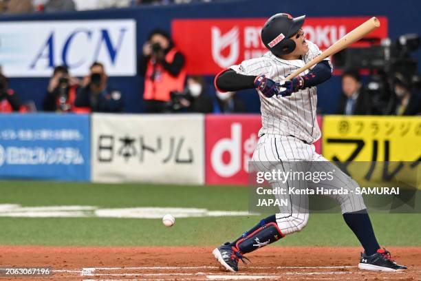 Infielder Kaito Kozono of Samurai Japan is hit by pitch in the 6th inning against Team Europe at Kyocera Dome Osaka on March 6, 2024 in Osaka, Japan.