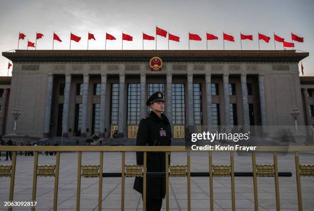 Member of the Peoples Armed Police stands at the entrance of the National Peoples Congress at the Great Hall of the People during delegation meetings...