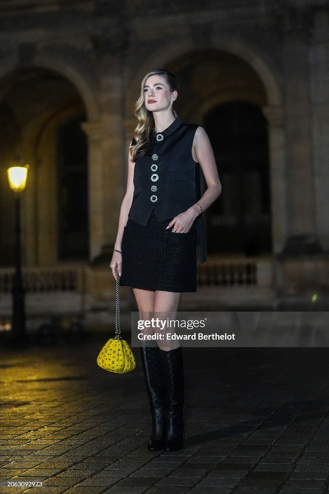 paris-france-zita-dhauteville-wears-a-sleeveless-waistcoat-a-black-mini-skirt-a-yellow-bag.jpg