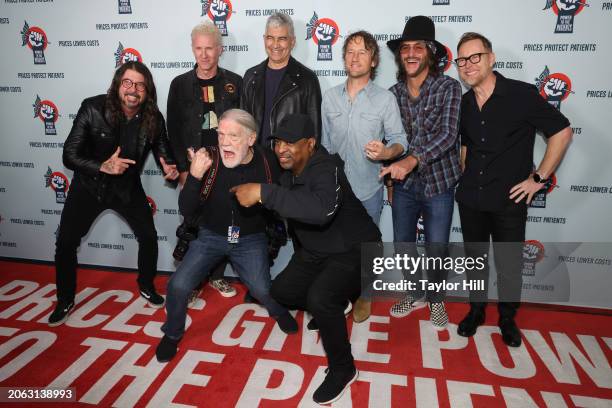 Henry Diltz and Chuck D, and Dave Grohl, Josh Freese, Pat Smear, Chris Shiflett, Rami Jaffee, and Nate Mendel of Foo Fighters attend the Power to the...