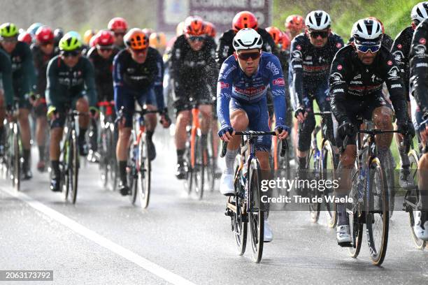 Fabio Van den Bossche of Belgium and Team Alpecin-Deceuninck and Julian Alaphilippe of France and Team Soudal-Quickstep compete in heavy rain during...