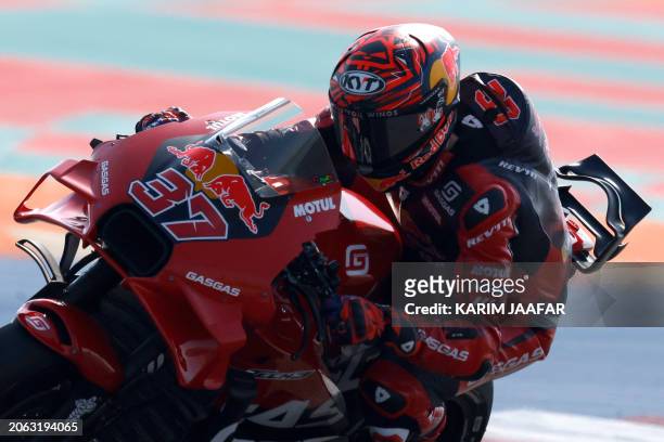 Red Bull GASGAS Tech3 Spanish rider Augusto Fernandez steers his bike during the second free practice session of the Qatar MotoGP Grand Prix at the...