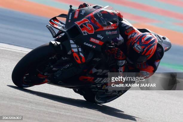 Aprilia Racing Spanish rider Maverick Vinales steers his bike during the second free practice session of the Qatar MotoGP Grand Prix at the Lusail...
