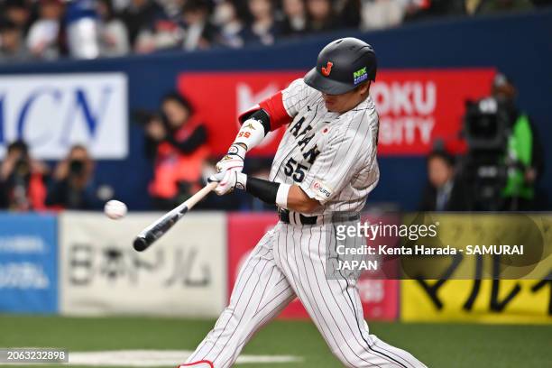 Designated hitter Munetaka Murakami of Samurai Japan hits a RBI single in the 1st inning against Team Europe at Kyocera Dome Osaka on March 6, 2024...