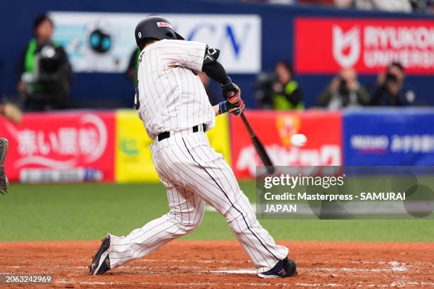 Outfielder Kensuke Kondo of Samurai Japan hits a two run double in the 5th inning against Team Europe at Kyocera Dome Osaka on March 6, 2024 in...