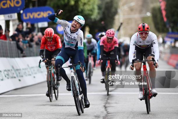 Phil Bauhaus of Germany and Team Bahrain - Victorious celebrates at finish line as stage winner ahead of of Jonathan Milan of Italy and Team...