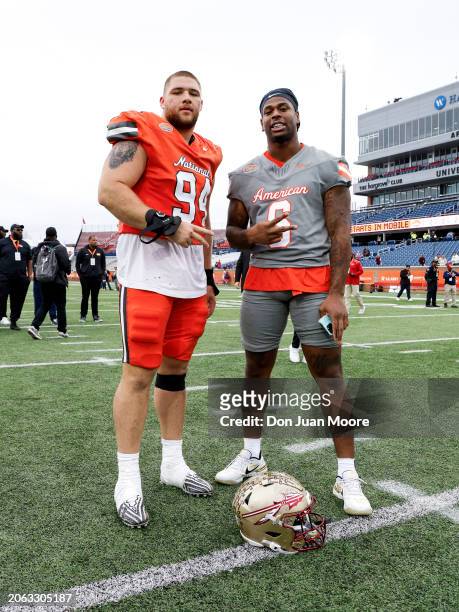 Defensive Lineman Braden Fiske of Florida State from the National Team pose with his college teammate Tight End Jaheim Bell of Florida State from the...