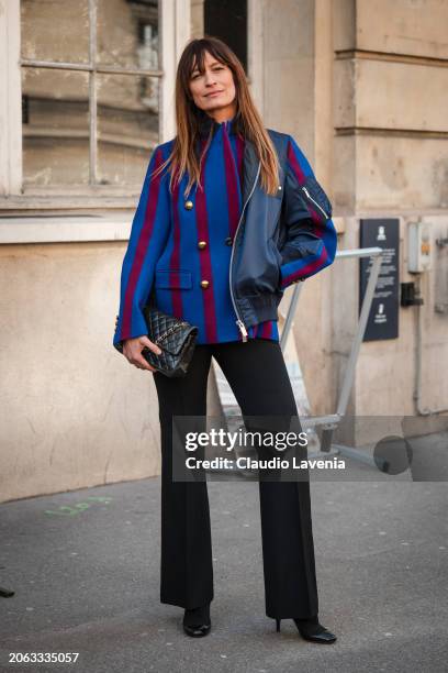 Caroline de Maigret wears burgundy and blue jacket, black pants, black bag, outside Sacai, during the Womenswear Fall/Winter 2024/2025 as part of...