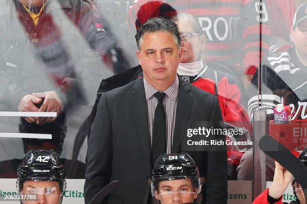 Travis Green Interim Head Coach of the New Jersey Devils on the bench in the first period the game against the New Jersey Devils at the Prudential...