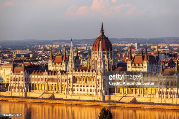 hungarian parliament building and danube river at sunset, aerial view, budapest, hungary - hungary stock pictures, royalty-free photos & images