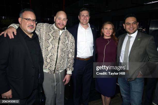 Miguel Cardona, Fat Joe, Dan Goldman, Melanie Stansbury, and Raul Ruiz attend the Power to the Patients Foo Fighters concert advocating for...