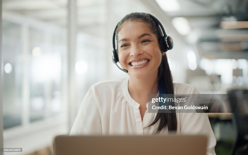 Woman, call center and computer in night, smile or listening for customer service with voip in office. Consultant, person or telemarketing agent for thinking, headphones and microphone for contact us