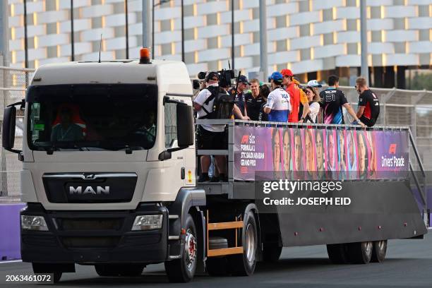 Drivers attend the drivers' parade before the start of the Saudi Arabian Formula One Grand Prix at the Jeddah Corniche Circuit in Jeddah on March 9,...