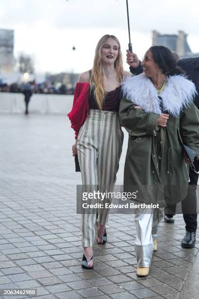 Sophie Turner wears a low-neck top, striped high waist pants, outside Louis Vuitton, during the Womenswear Fall/Winter 2024/2025 as part of Paris...