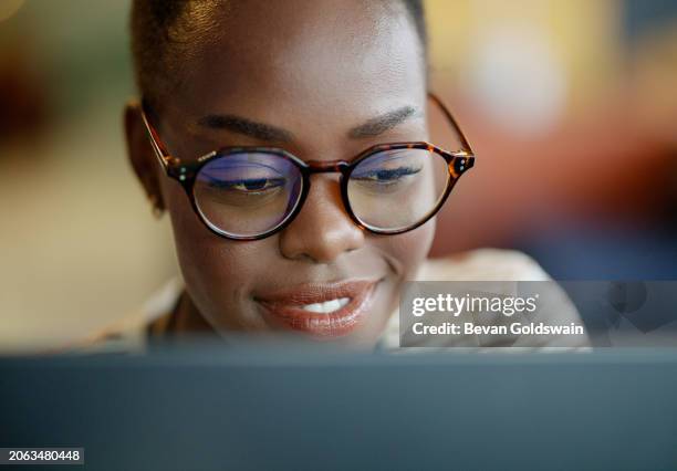 face, black woman and college student on computer with smile for research, study and information for exams. female person, education and university with revision for project, test and deadline. - persistência imagens e fotografias de stock