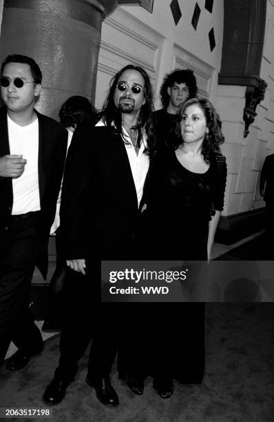 Actress Kathy Najimy and guest attend the after-party for the premiere of Unzipped at Barney's department store in Beverly Hills, CA on July 27, 1995.