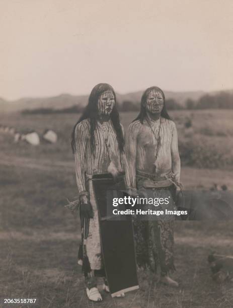 Sun dance pledgers-Cheyenne, circa 1910. Two young men in ceremonial paint. Creator: Edward Sheriff Curtis.