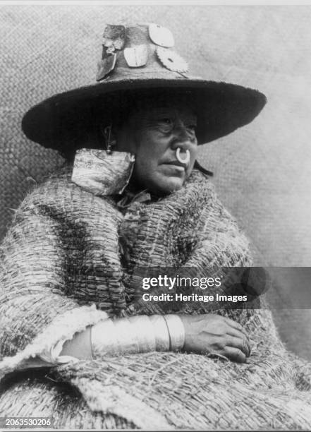 Chief's daughter-Nakoaktok, circa 1914. Nakoaktok woman, half-length portrait, facing right, seated, wearing a blanket, a hat with shell ornaments,...