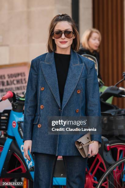 Olivia Palermo wears black top, blue denim blazer with matching flared jeans, taupe Hermes bag, outside Zimmermann, during the Womenswear Fall/Winter...