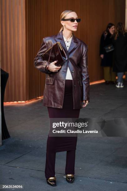 Viky Rader wears beige polo neck , brown leather blazer, brown skirt over pants, black heels with gold details, outside Zimmermann, during the...