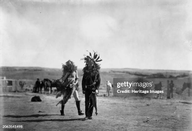 Toneneli and Haschelti, circa 1905. Two Navajo men impersonating two Yeibichai, Toneneli and Haschelti on the 6th day of the Yeibichai ceremony....