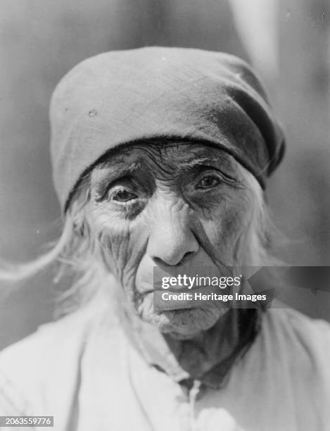 Serrano woman of Tejon, circa 1924. Serrano woman, head-and-shoulders portrait, facing front. Creator: Edward Sheriff Curtis.