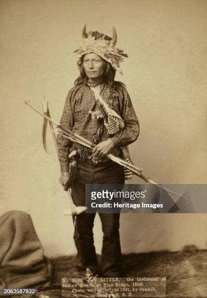 Little, instigator of Indian Revolt at Pine Ridge 1891. Little, Oglala band leader, full-length studio portrait, standing, facing front, wearing horn...