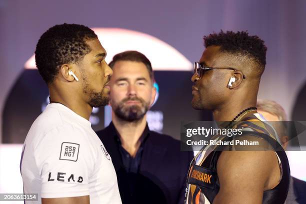 Anthony Joshua and Francis Ngannou face-off at the press conference ahead of their 'Knockout Chaos' heavyweight fight at Boulevard World on March 06,...