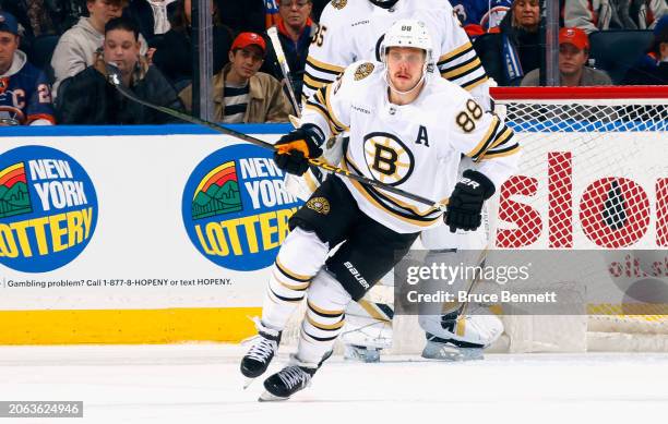 David Pastrnak of the Boston Bruins skates against the New York Islanders at UBS Arena on March 02, 2024 in Elmont, New York.