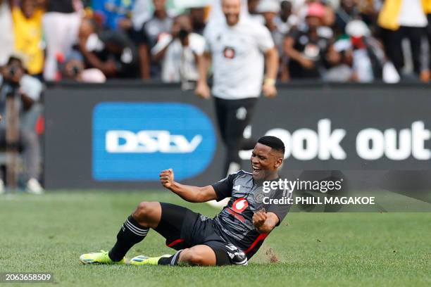 Pirate's South African midfielder Thabiso Lebitso celebrates after scoring his team's third goal during the Premier Soccer League South African...