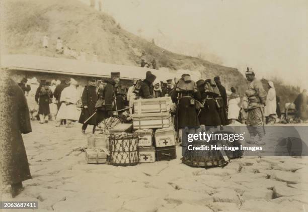 Japanese Hospital Corps landing medical and surgical supplies at Chemulpo, circa 1904. Creator: Robert Lee Dunn.